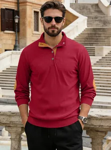 Close-up of men's burgundy ribbed Henley shirt with yellow elbow patches and contrast collar
