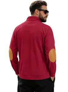 Detail of dark red corduroy shirt showing elbow patches and ribbed cuff texture