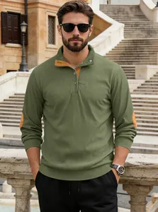 Detail of green corduroy Henley shirt showing brown suede elbow patches and ribbed cuffs