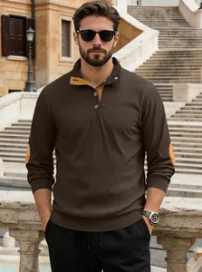 Detail of men's brown corduroy Henley shirt with contrast elbow patches and button neck