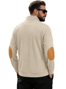 Detail view of beige corduroy sweatshirt featuring vintage brown oval elbow patches