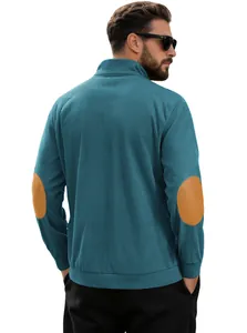 Detail of dark teal corduroy pullover with brown oval elbow patches on long sleeves
