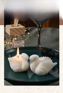 Macro detail of elegant white swan scented candles with realistic feather textures