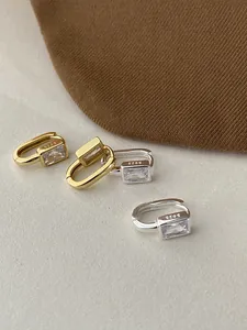 Detail showing S925 silver hallmarks and square cubic zirconia in gold and silver