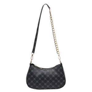 Classic black crescent shoulder bag with grey floral print and gold chain strap