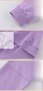 Close-up of ribbed cuffs and hem stitching on girls purple cotton unicorn sweatshirt