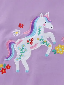 Girl's purple sweatshirt with colorful unicorn and flower embroidery on front