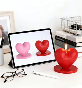 Close-up of heart shaped scented candle with base in a warm aesthetic home setting
