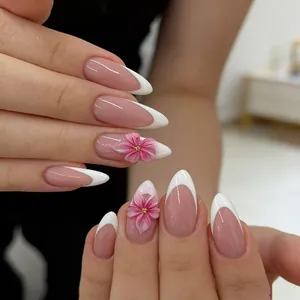 French almond press-on nails with 3D pink cherry blossoms and gold floral accents