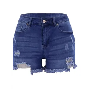 Detailed view of frayed hem and ripped denim texture on high waist blue shorts