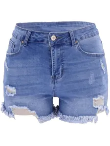 Detail of light blue high-waisted denim shorts featuring distressed rips and raw hem edges