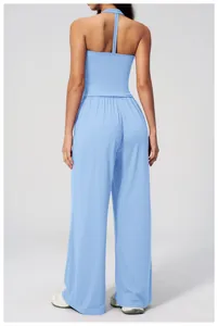 Detail view of light blue brushed backless yoga top and high-waist wide-leg pants