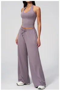 Close-up of lavender v-neck sports top and high-waisted wide-leg yoga pants set