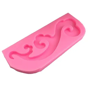 Pink silicone mold featuring traditional Chinese cloud patterns for fondant and baking