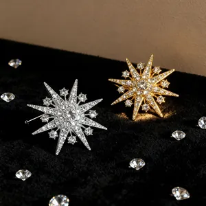 Elegant snowflake star brooch pins with crystals in silver and gold plating