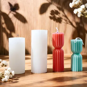 Spiral column silicone mold for DIY scented candles on a rustic wooden background