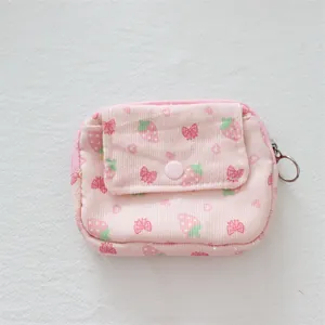 Close-up of strawberry print corduroy coin purse with snap flap and metal zipper