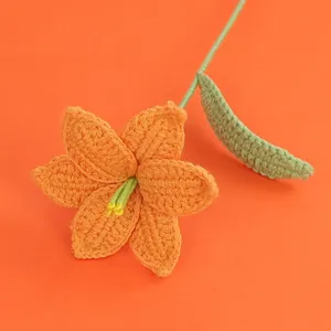 Handmade crochet orange lily flower with detailed knitted petals and green stem
