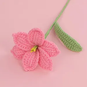 Handmade crochet pink lily flower with green stem and leaf for gift decoration