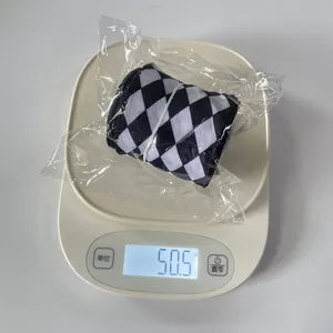 Detail view of 6cm black and white checkered Christmas ribbon weighing 50.5g