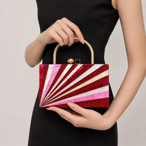 Detail of evening bag with radial marble pattern, gold metal handle and luxury clasp