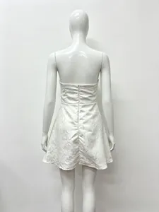 Detail of the pearl white jacquard fabric texture and back invisible zipper on the dress