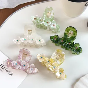 Three-petal floral cellulose acetate hair claw clips with colorful rhinestones in 5 colors