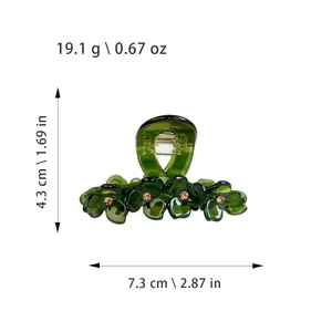 Deep green floral hair claw clip with rhinestones and dimensions shown on white background