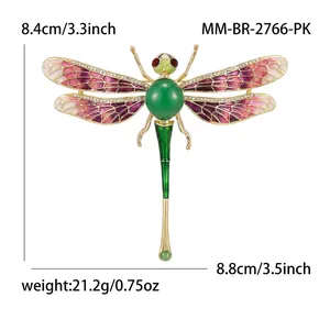 Élégante broche libellule dorée avec ailes en émail rose et strass brillants