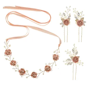 Elegant bridal hair set with handmade flowers, pearls, and ribbons in dusty rose pink