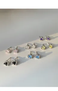 Array of colorful heart-shaped zirconia earrings in pink, blue, yellow, and purple colors