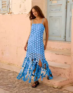 Detailed view of light blue sequined hollow out dress with fringe tassels for summer