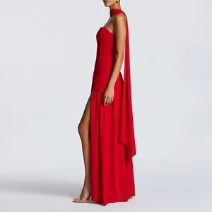 Detail of red floor-length dress with high side slit and elegant neck sash design