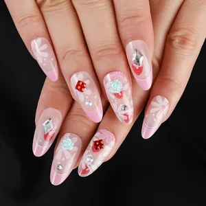 Almond press-on nails with French gradient tips, strawberry motifs, and 3D floral rhinestones