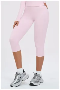 Detail shot of light pink long sleeve top and capri leggings yoga set for women