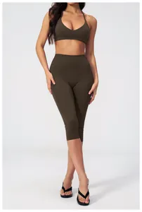 Deep olive yoga set featuring cross-back sports bra and high-waisted seamless leggings