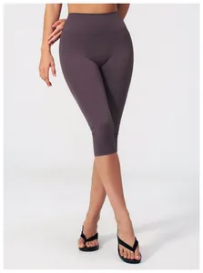 Detailed texture of high-waist brushed yoga shorts in deep purple matte fabric