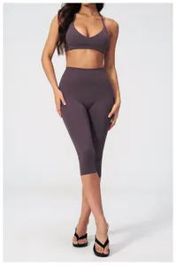 Detail of high-waisted smoky purple yoga leggings and matching sports bra set