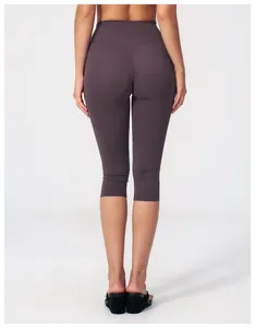 Detailed back view of high-waisted deep purple yoga leggings with V-shaped stitching