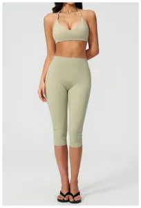 Detail of light green halter yoga bra and high waist biker shorts set for women
