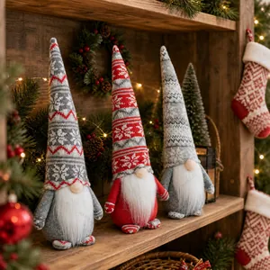 Three Christmas gnomes with snowflake knitted hats on a rustic wooden shelf