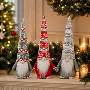 Three Christmas gnomes with knitted snowflake hats and white beards on a festive background