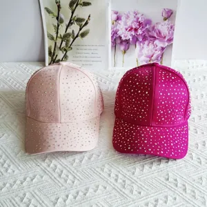 Stylish rhinestone-studded baseball cap in pink tones with glittering crystals