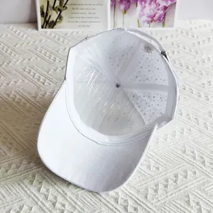 Detail of white cotton baseball cap interior with adjustable strap and breathable lining