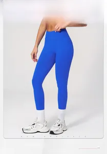 Detail of high-waist royal blue seamless yoga leggings on model with 176cm height