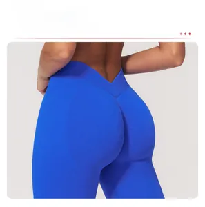 Close-up of the V-shaped high waistband and push-up seam on blue yoga leggings