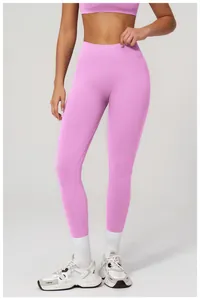 Macro detail of high-waist ribbed waistband on purple seamless yoga leggings