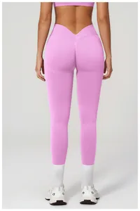 Detail of pink high-waisted seamless yoga leggings with V-cut back scrunch design