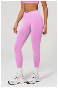 Detail showing pink high-waisted seamless yoga leggings with compression knit fabric