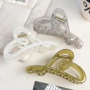 Elegant heart-shaped hair claws in smoky grey, creamy white and olive green resin